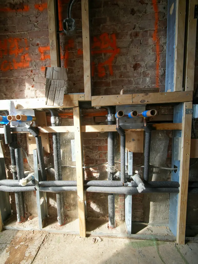 Exposed pipework in a wall