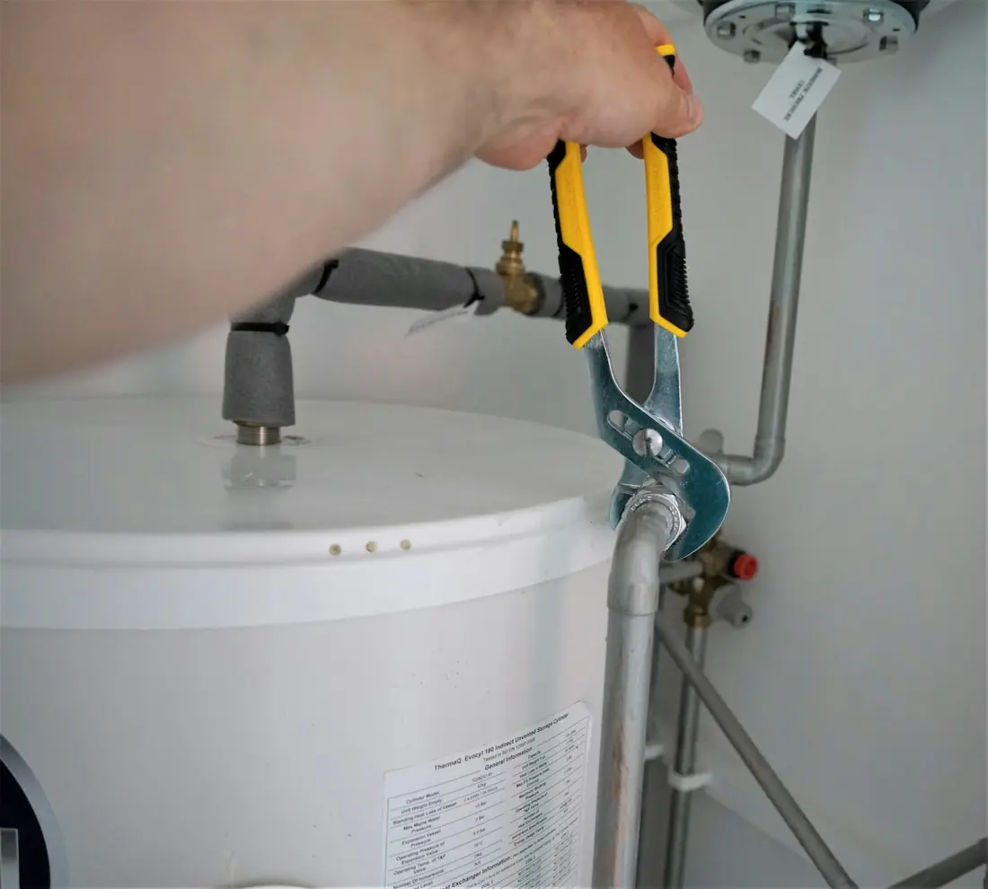 Plumber holding a hand tool